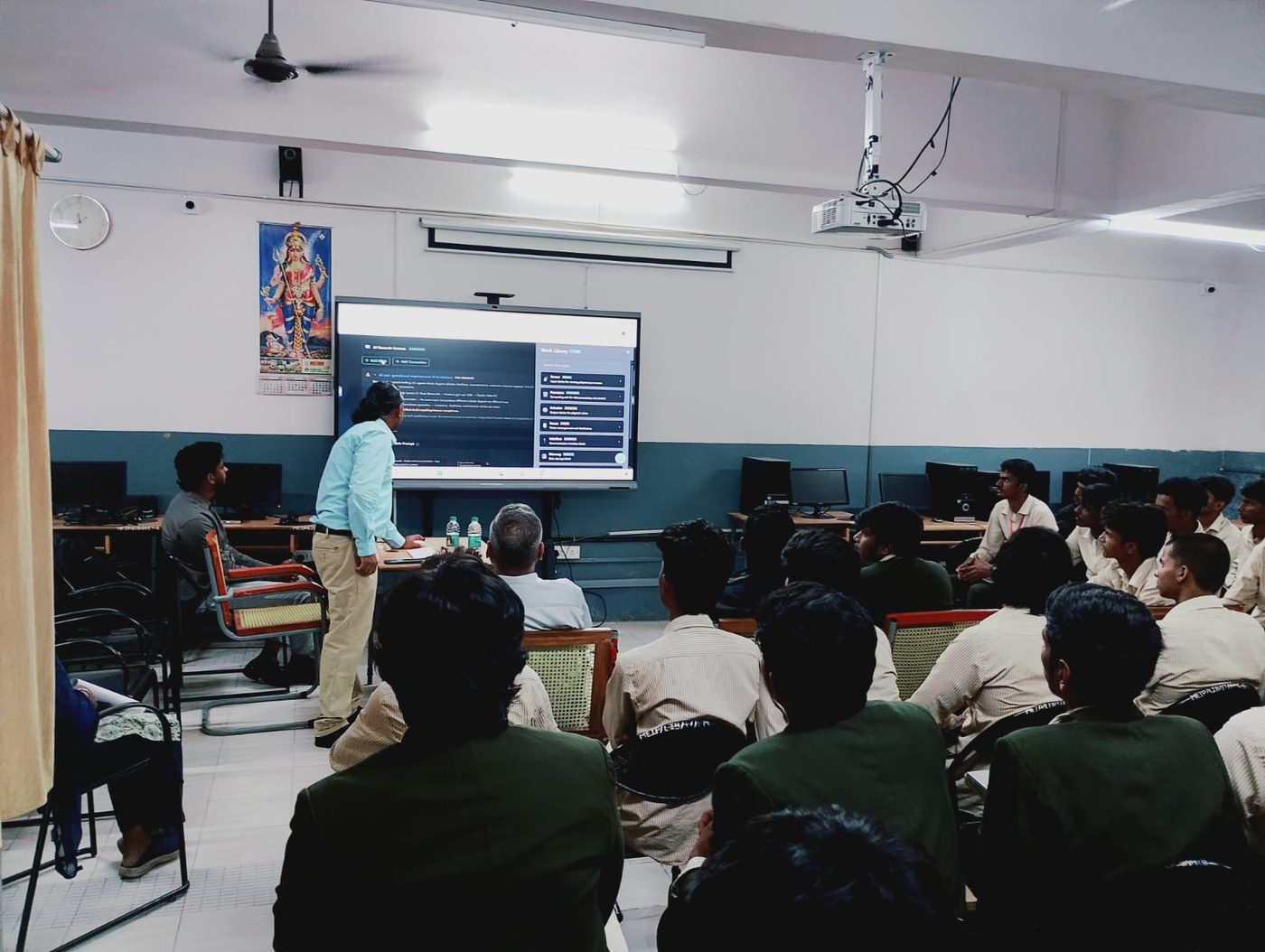 Students following the design on screen in the lab